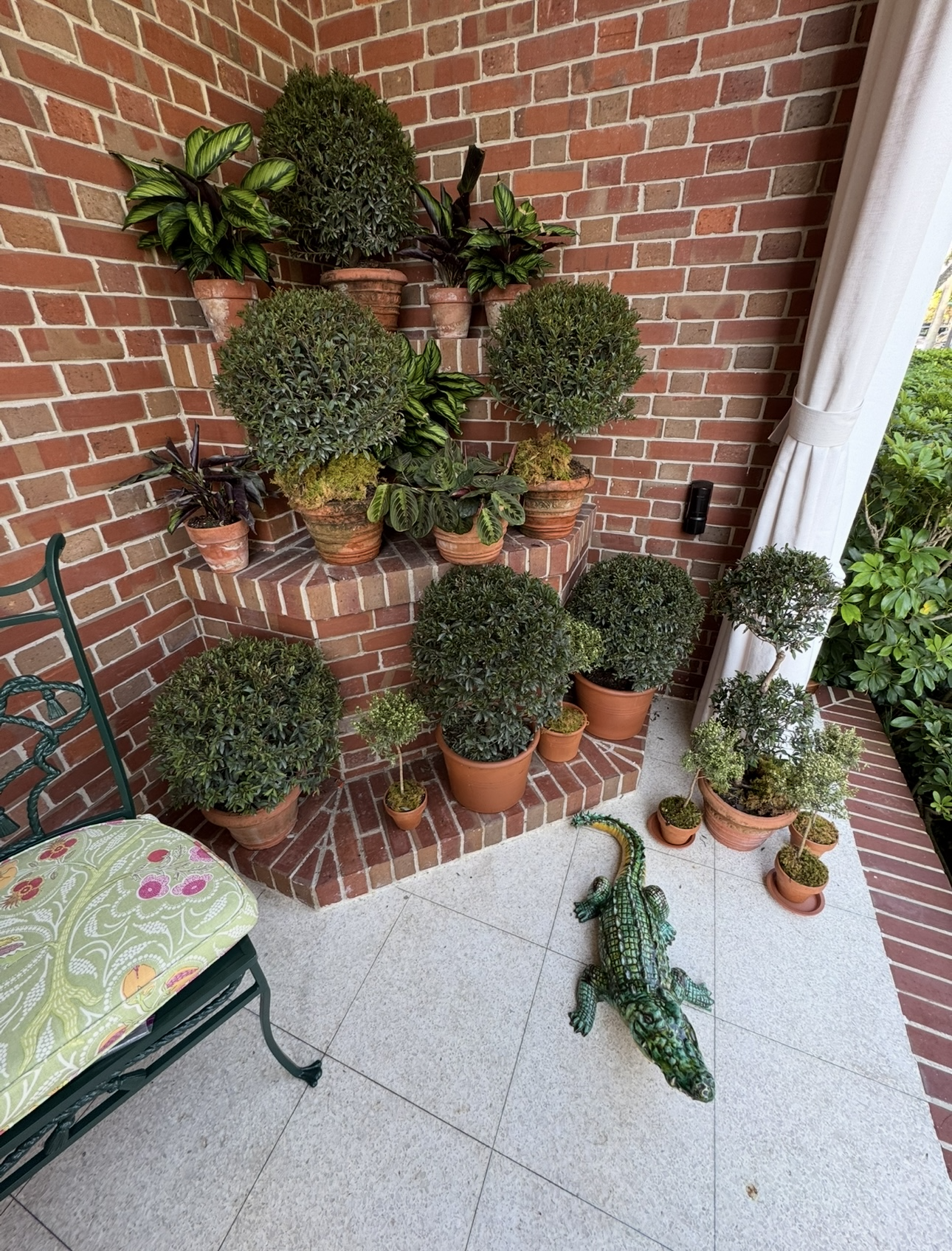 Lush Outdoor Living: Curated Porch Design with Timeless Garden Style 